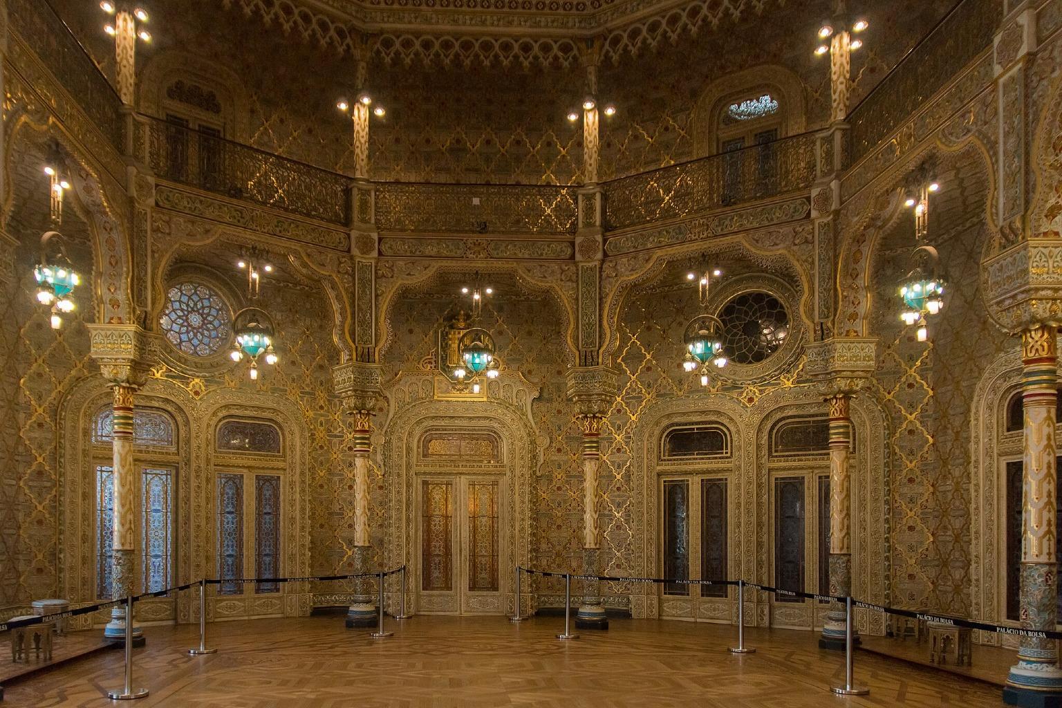 The Salão Árabe (Arabian Room), a luxurious 19th-century room, is decorated with gold Arabic script on its walls and ceiling.