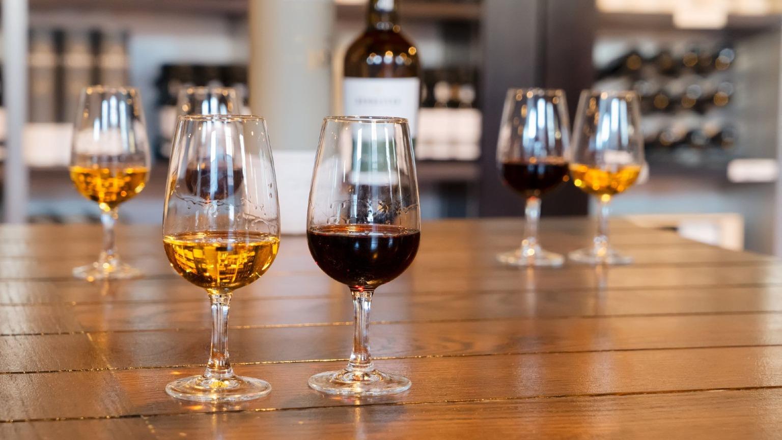 Image of a table with various port wines ready to serve