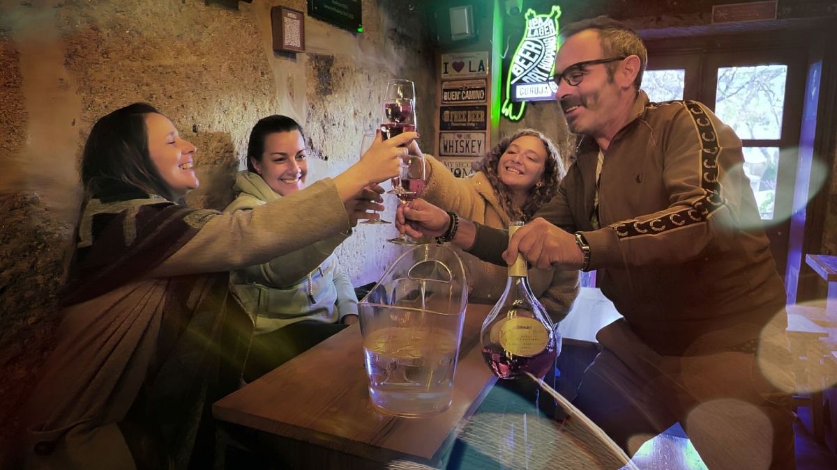 Making a rosé wine toast at a local and traditional place in Porto during our Oporto Food Tour | Cooltour Oporto