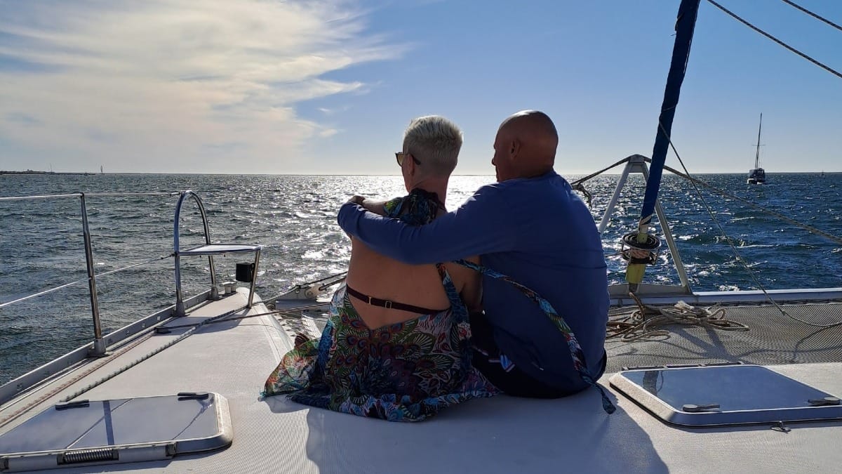 0dml catamaran faro boat tour guests relaxing ocean