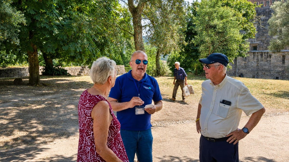 Guests exploring the surroundings of Guimarães Castle and the Palace of the Dukes of Braganza with their guide.