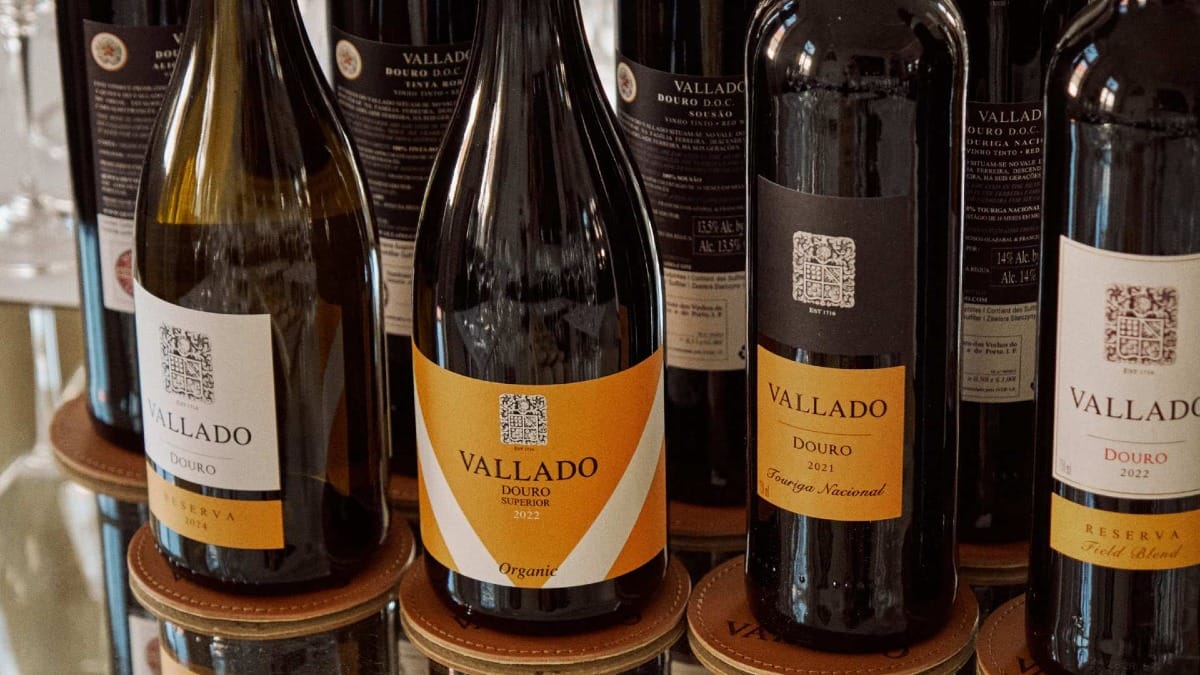 Selection of Quinta do Vallado Douro wines lined up on a glass table for tasting