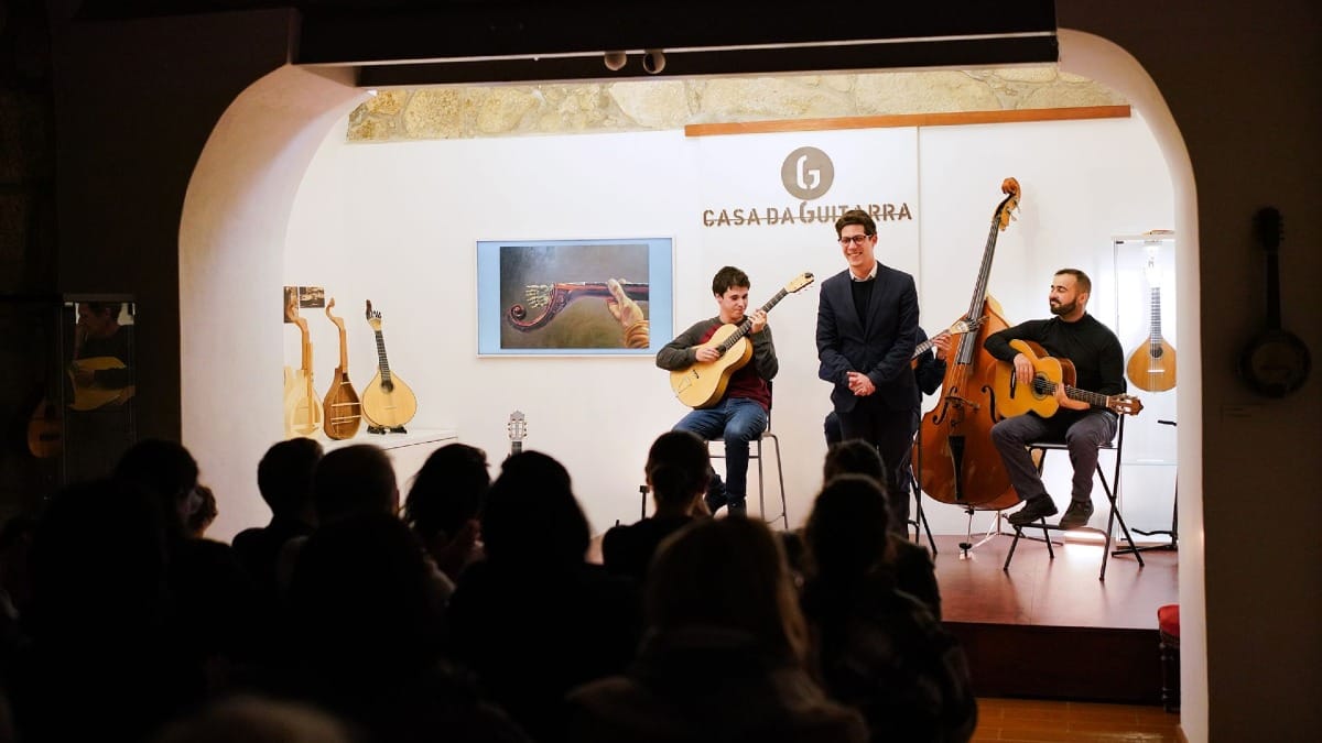 Male Fado singer smiling to the audience after his performance at Casa da Guitarra in Porto