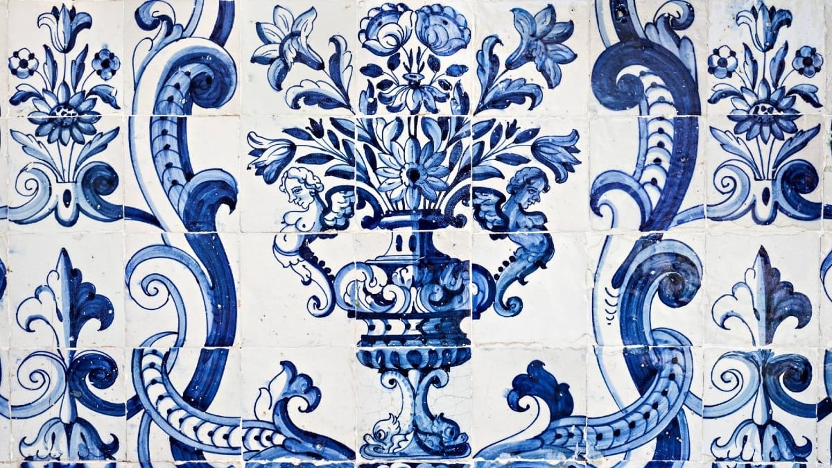 Intricate azulejo tiles at the University of Évora showcasing Portuguese decorative artistry and symbolism.