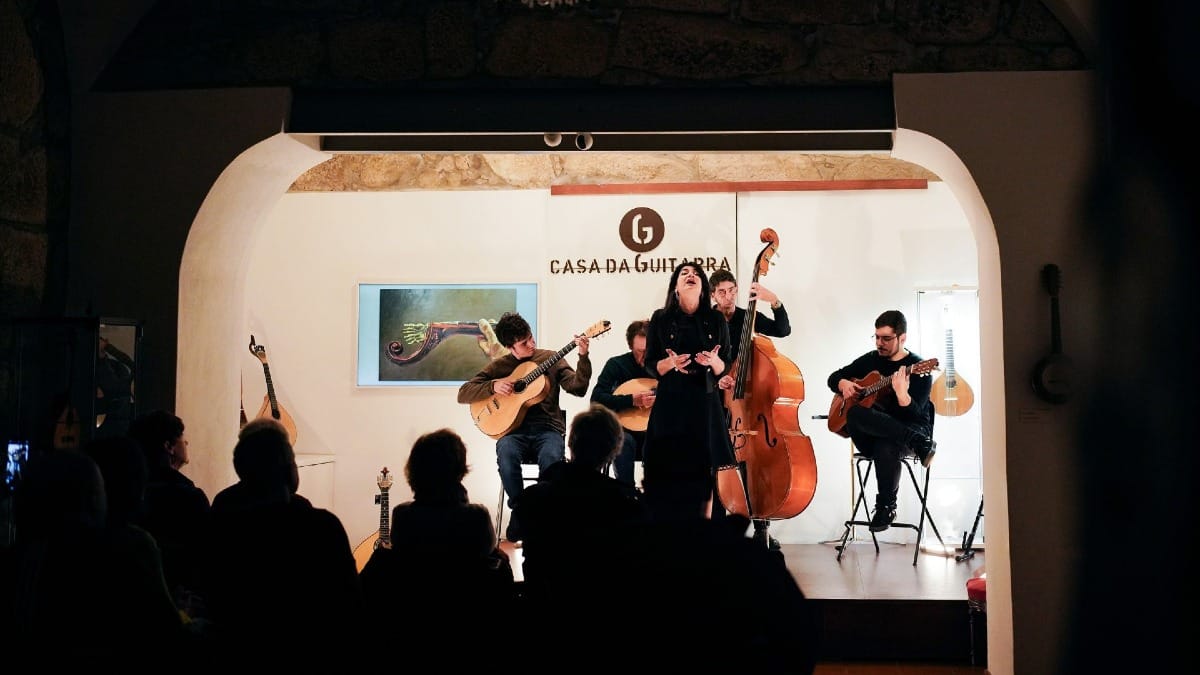 Atmosphere at Casa da Guitarra during a live Fado performance in Porto