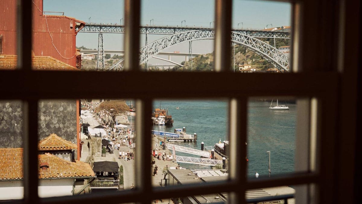 View of Ribeira and Dom Luís I Bridge from a tasting room window in Porto