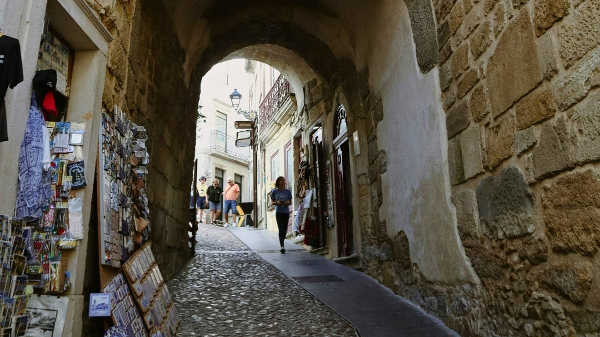DoCT coimbra old town archway souvenir stalls
