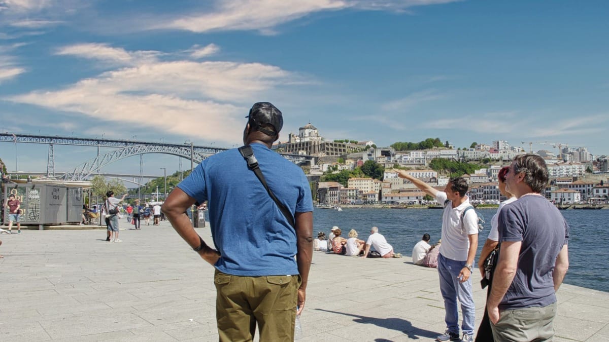 Cooltour Oporto guide explaining the history of Ribeira by the Douro River with scenic views