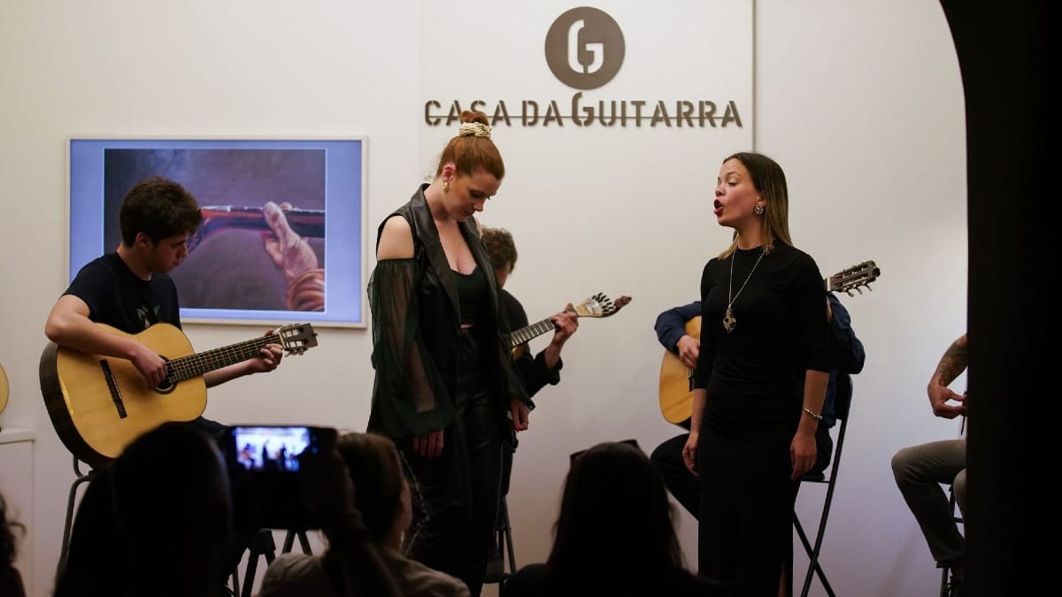 Two female Fado singers performing together at Casa da Guitarra in Porto