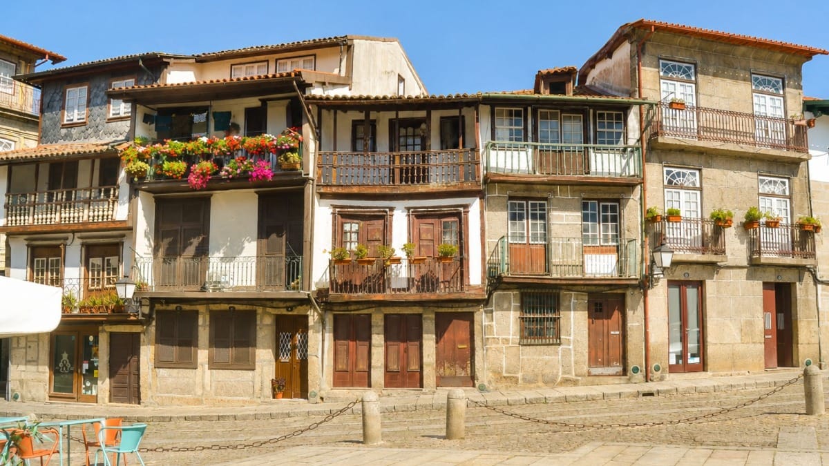 Medieval timber-framed buildings in Guimarães visited during a private cultural tour from Porto.