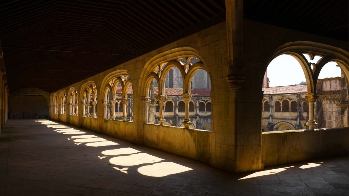 LR9B alcobaca monastery gothic cloisters light shadow