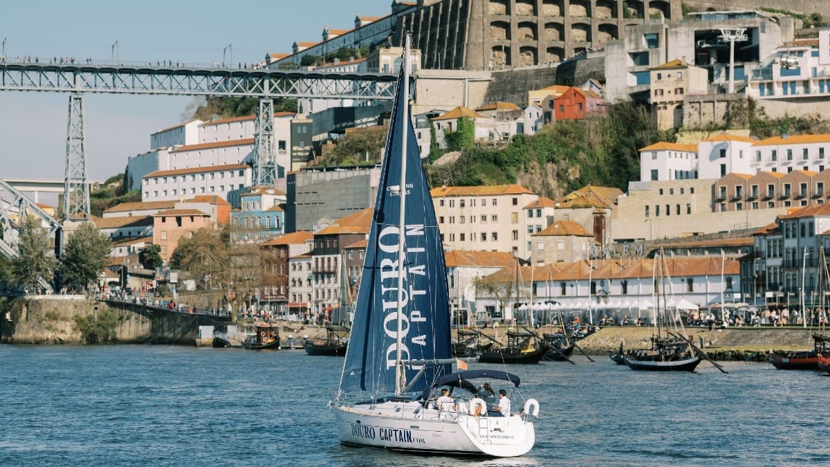 Private boat sailing on the Douro River in Porto with panoramic city views