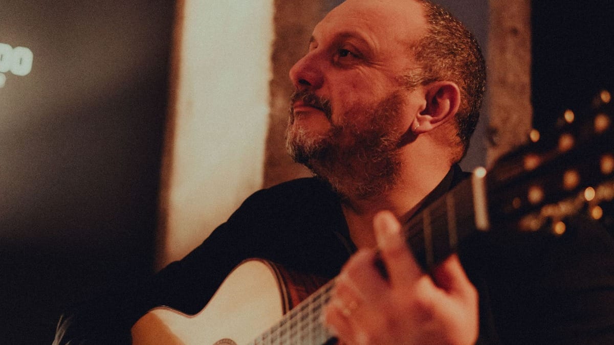 Classical guitar player during a live Fado concert at a wine bar near Clerics Tower
