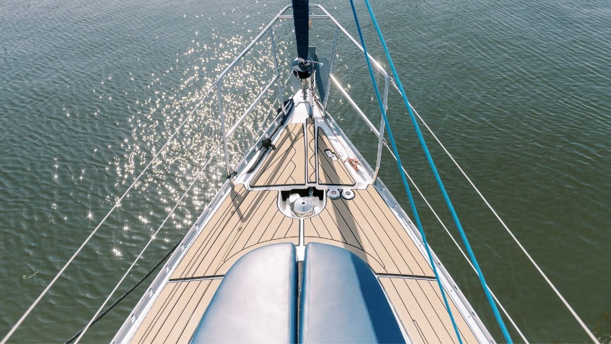 Boat’s bow and reflections of golden sunset light on the Douro river in Porto