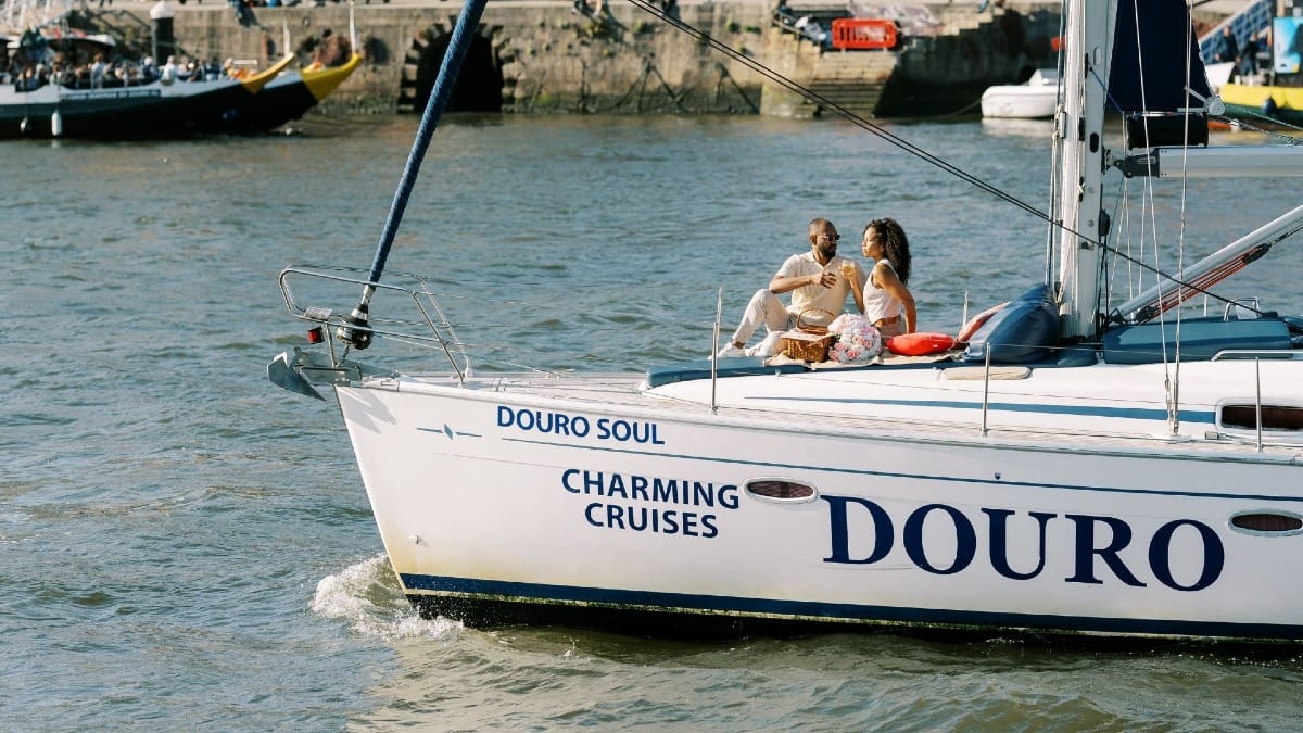 Couple enjoying comfort and exclusivity on a private sunset boat cruise in Porto