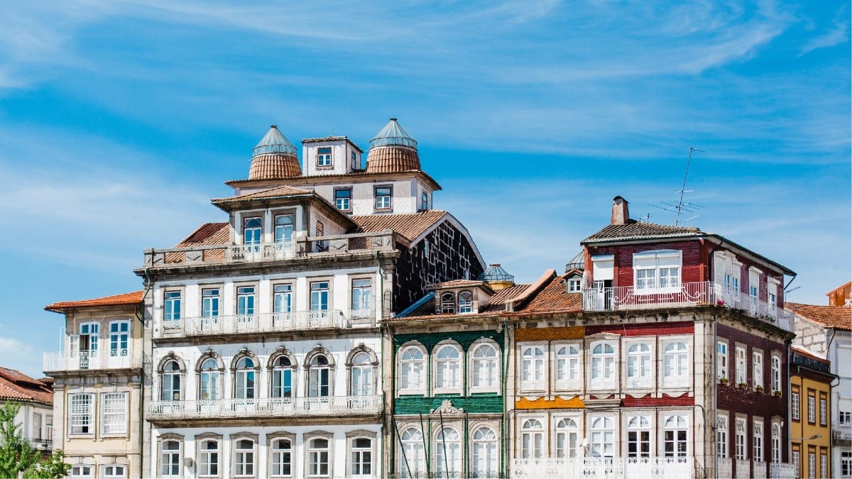 Traditional old buildings in Guimarães’ medieval town center during a Braga and Guimarães Tour with Cooltour Oporto