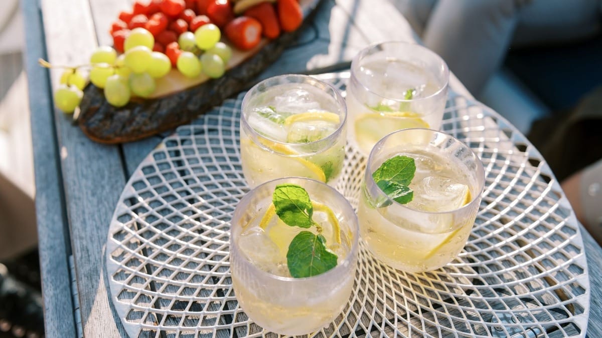 Four glasses of a refreshing cocktail offered during a Porto boat tour