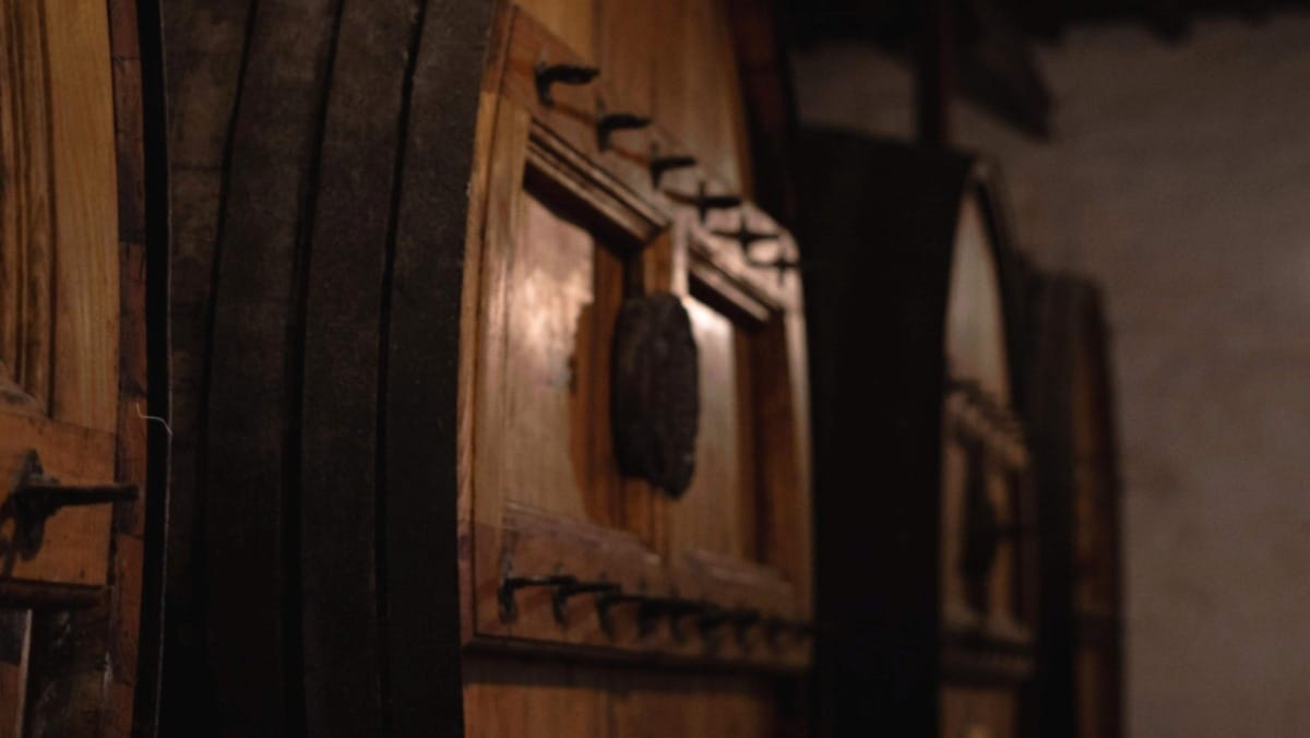 Step into the quiet atmosphere of a centuries-old wine cellar