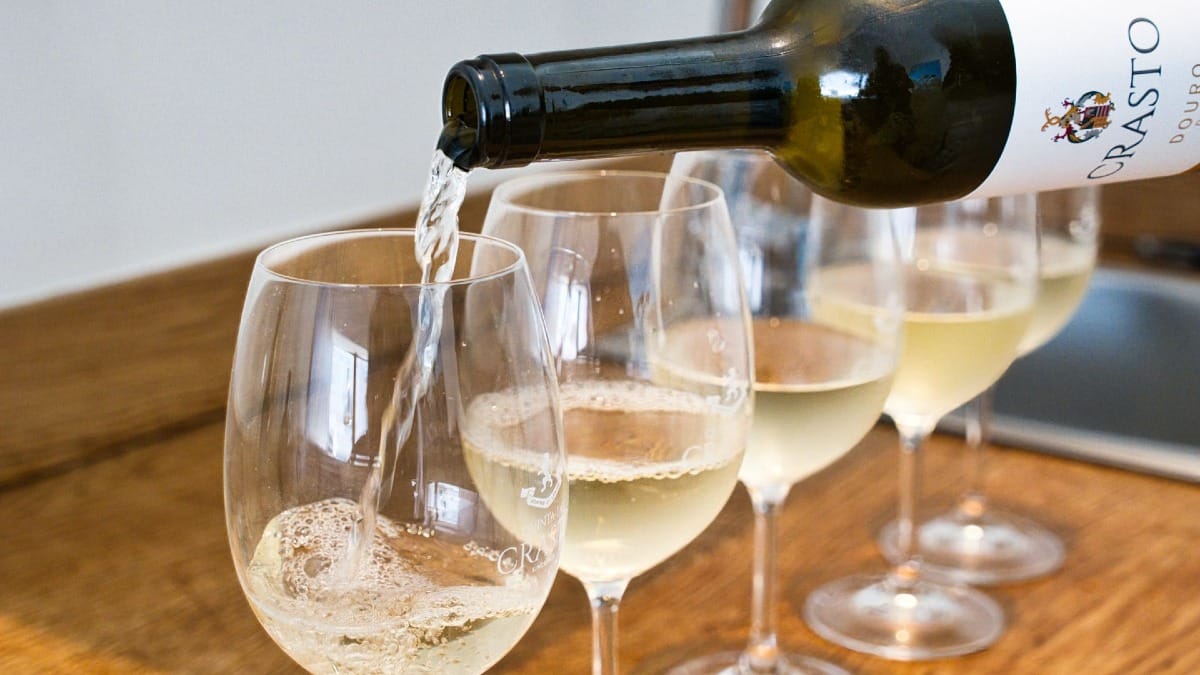 Douro white wine being poured for a tasting during the Porto Food Tour by Cooltour Oporto
