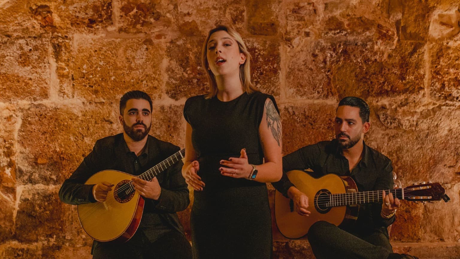 Traditional Fado performance in Lisbon with singer and Portuguese guitar musicians