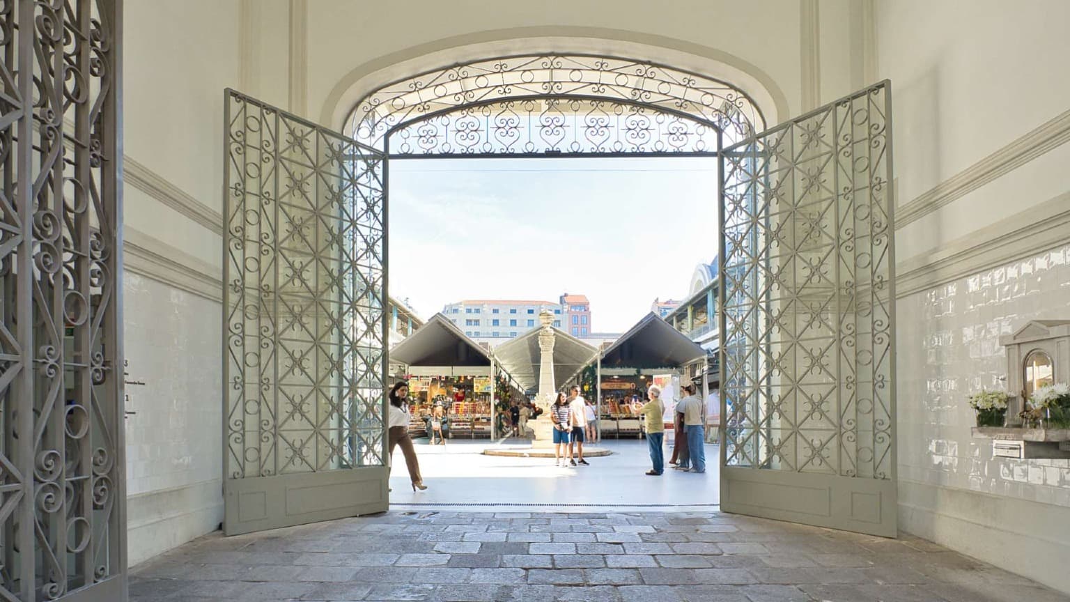 Main entrance of Mercado do Bolhão in Porto leading to the historic food market courtyard