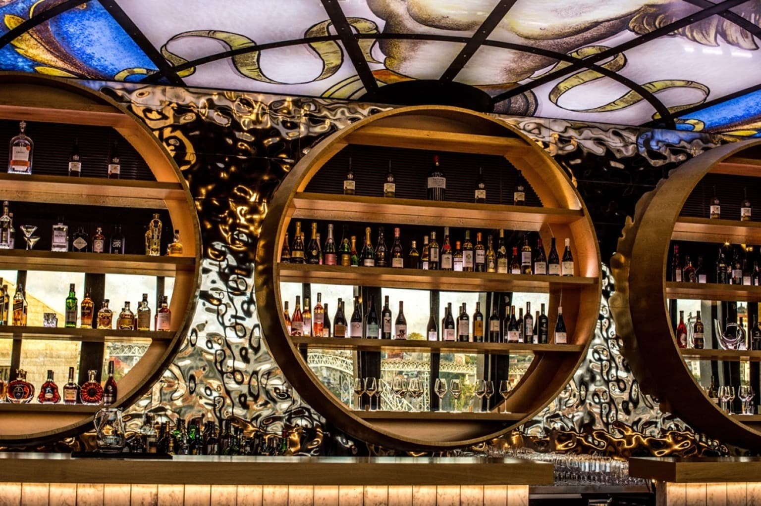 Immerse yourself in the vibrant atmosphere of the World of Wine's bar, where the selection of beverages complements the overall experience of this cultural and culinary destination