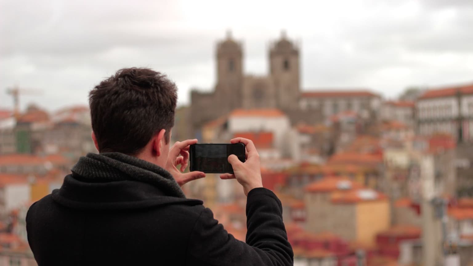 Visitor admiring Porto Cathedral during the Cooltour Oporto Private Porto Walking Tour
