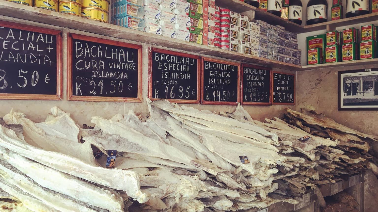 Traditional Portuguese market displaying salted bacalhau for sale