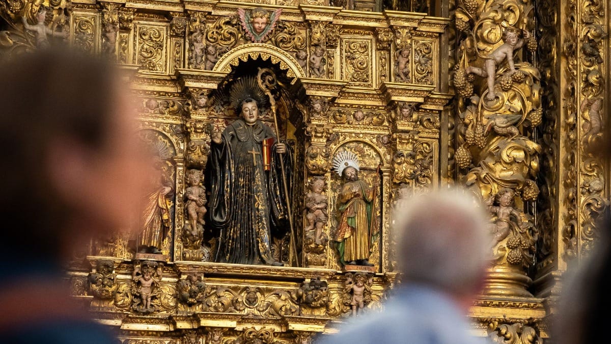 Detailed view of the gold and antique architecture inside a historic Monastery in Porto, Portugal